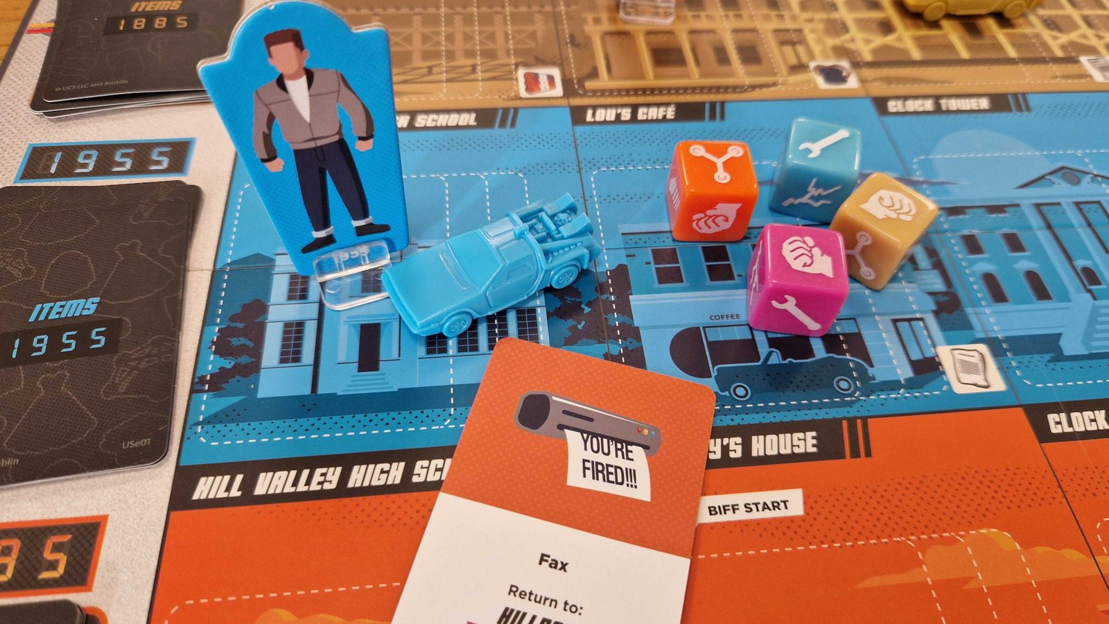 Back to the Future: Dice Through Time tokens, dice, and cards on a colorful board