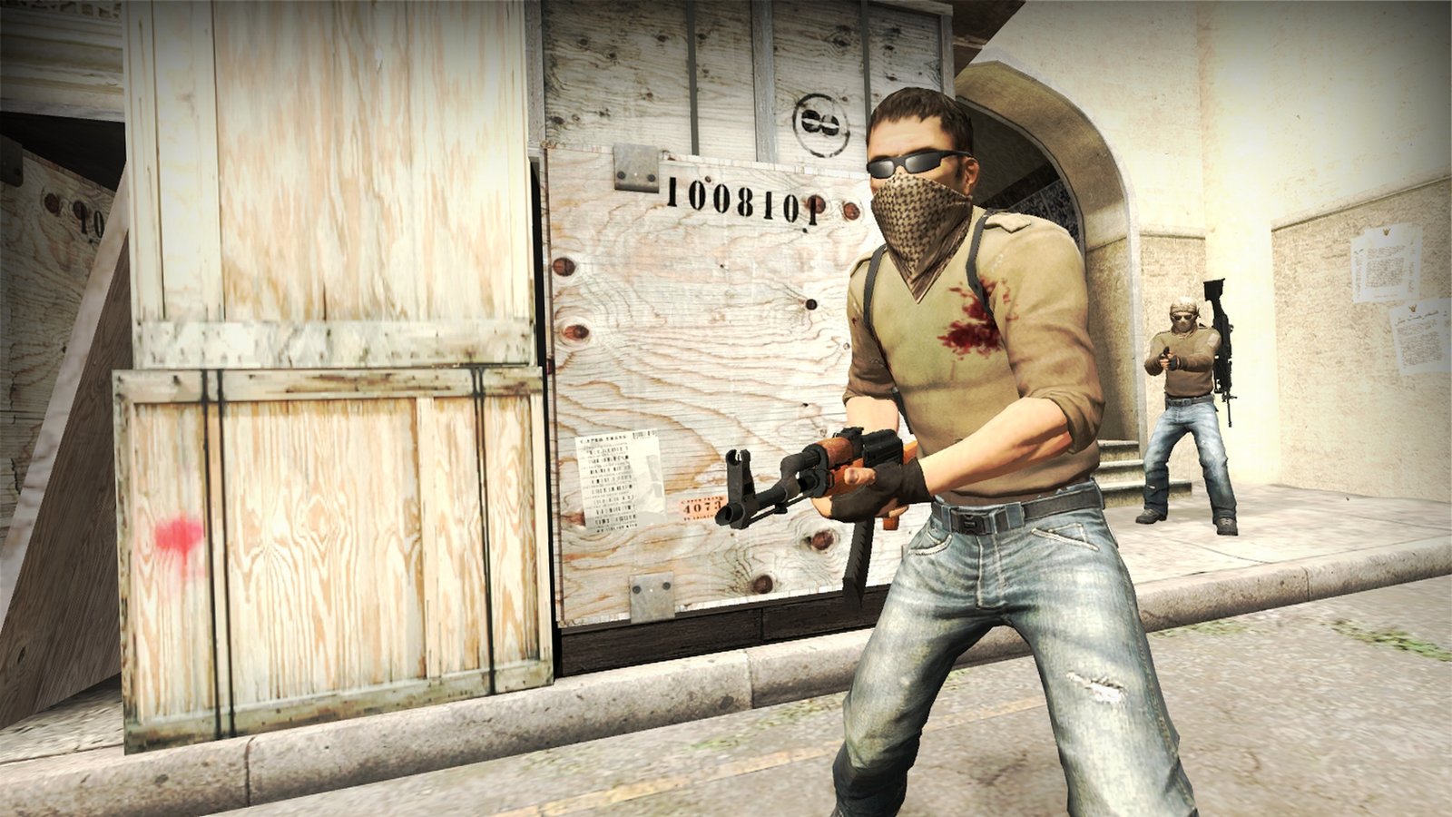 Two players camping on a map during the FPS game Counter-Strike: Global Offensive.