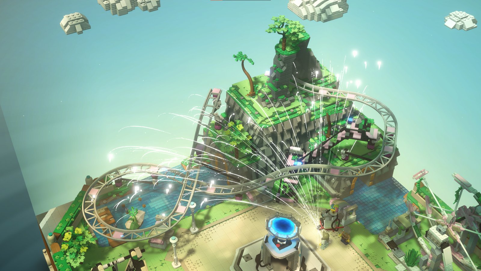 A railway track being built on a green island during Lego Bricktales, showing the game's building focus that makes it our top pick for the best Lego game of all time
