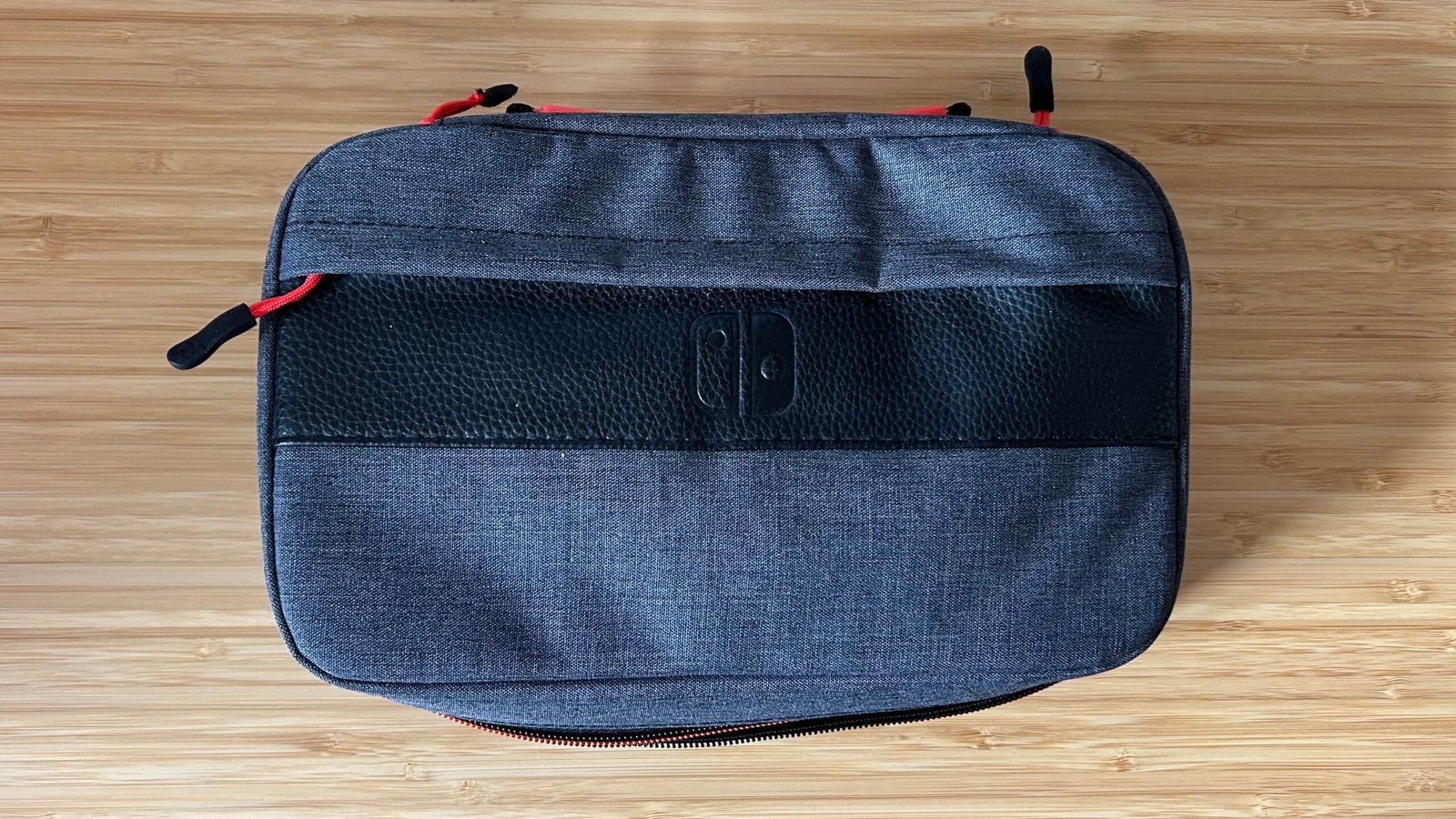 PDP messenger case closed on a wooden table