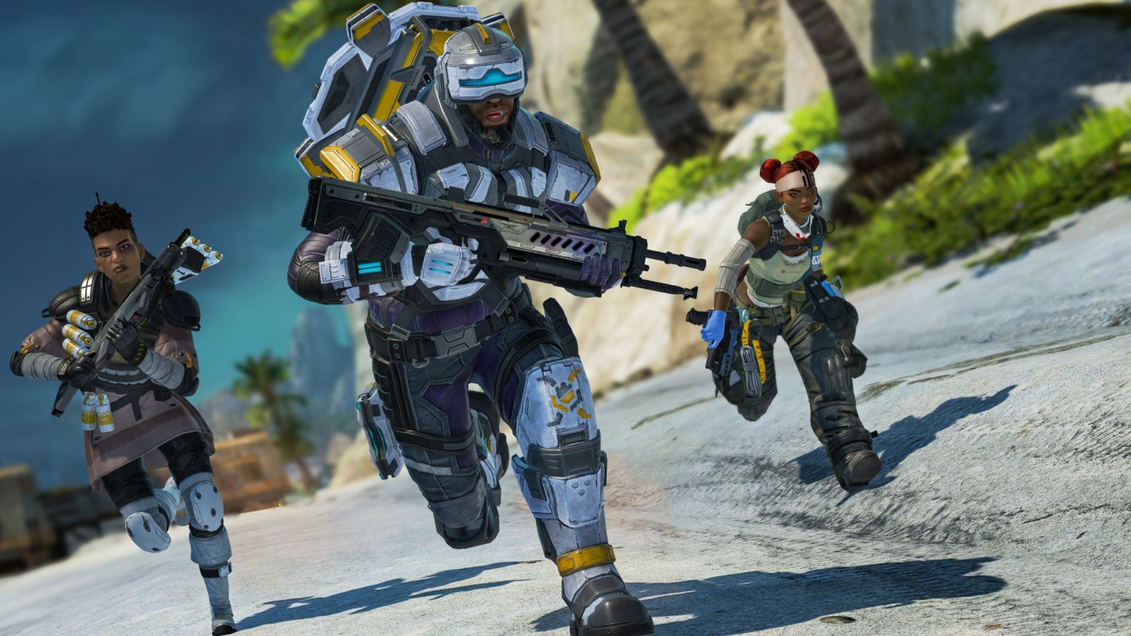 Three players running across a beach during the FPS game Apex Legends.
