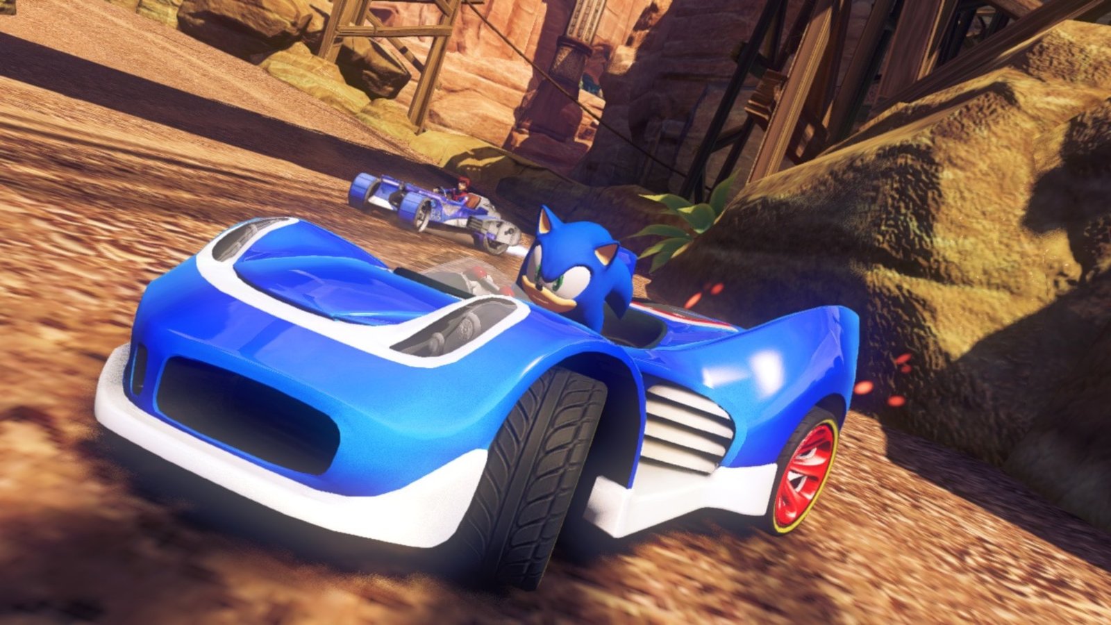 On a dirt racetrack in Sonic & All-Stars Racing Transformed, Sonic speeds in a blue sports car