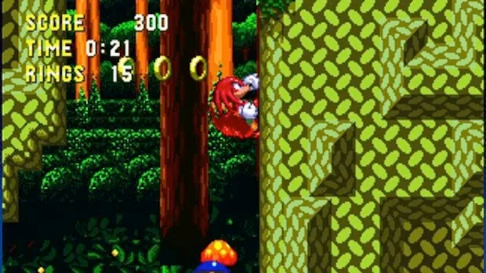 Sonic 3 and Knuckles on the Sega Genesis showing Knuckles climbing up a forest platform