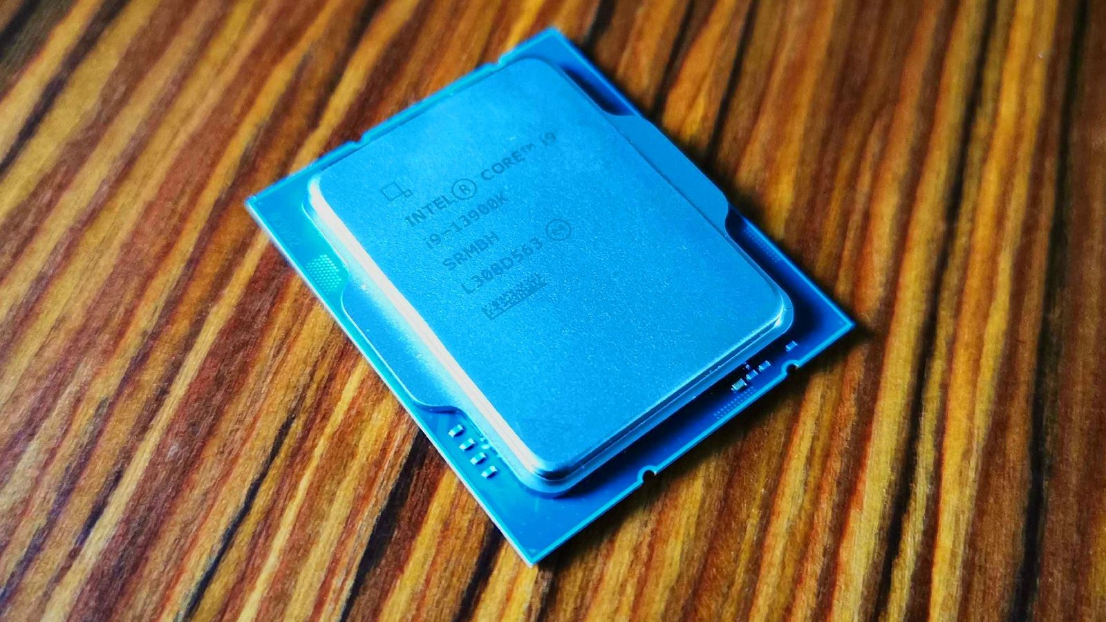 13th-gen Intel Core i9-13900K CPU sitting on woodgrain table