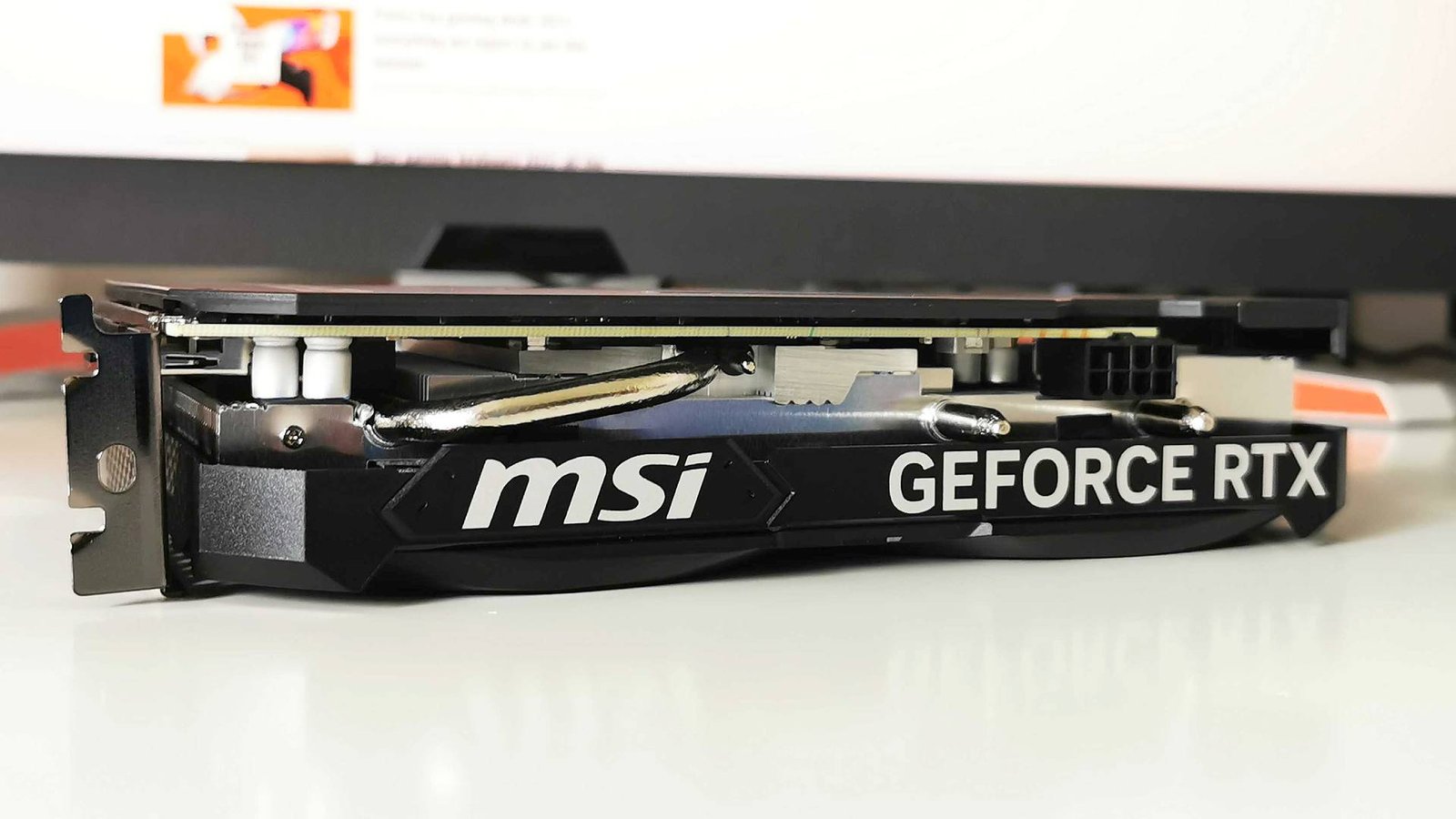 MSI RTX 4060 with logo facing camera on white surface