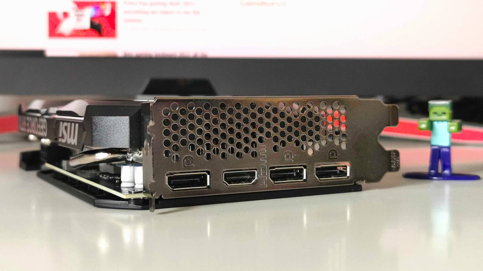 Nvidia RTX 4060 with ports facing camera on white desk