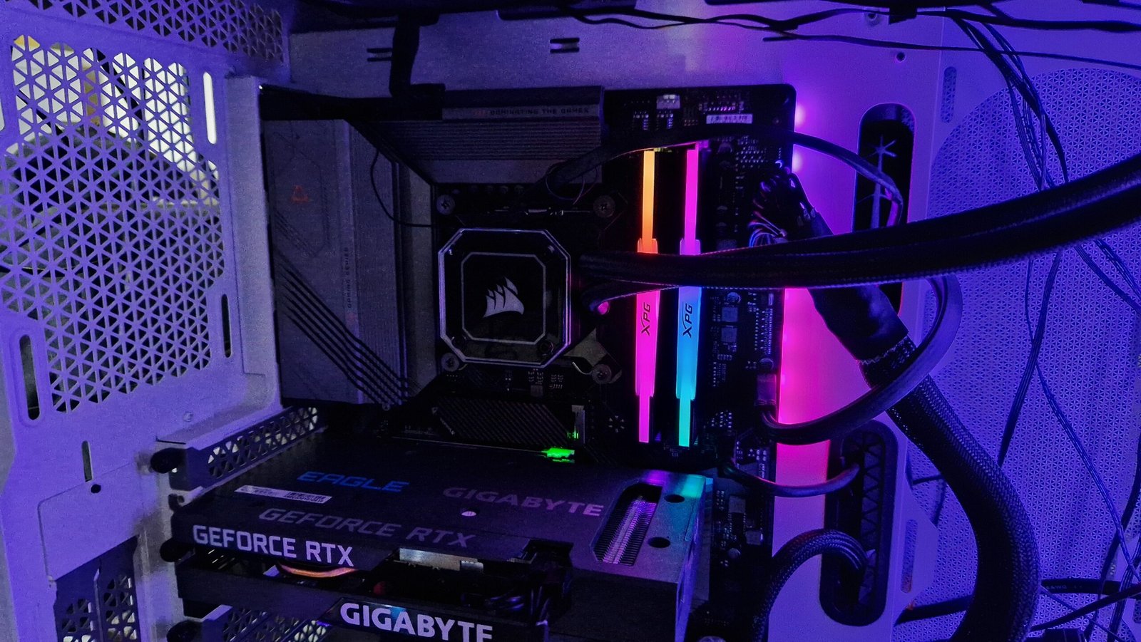 XPG Lancer RGB DDR5 RAM shown installed on a motherboard of a gaming PC