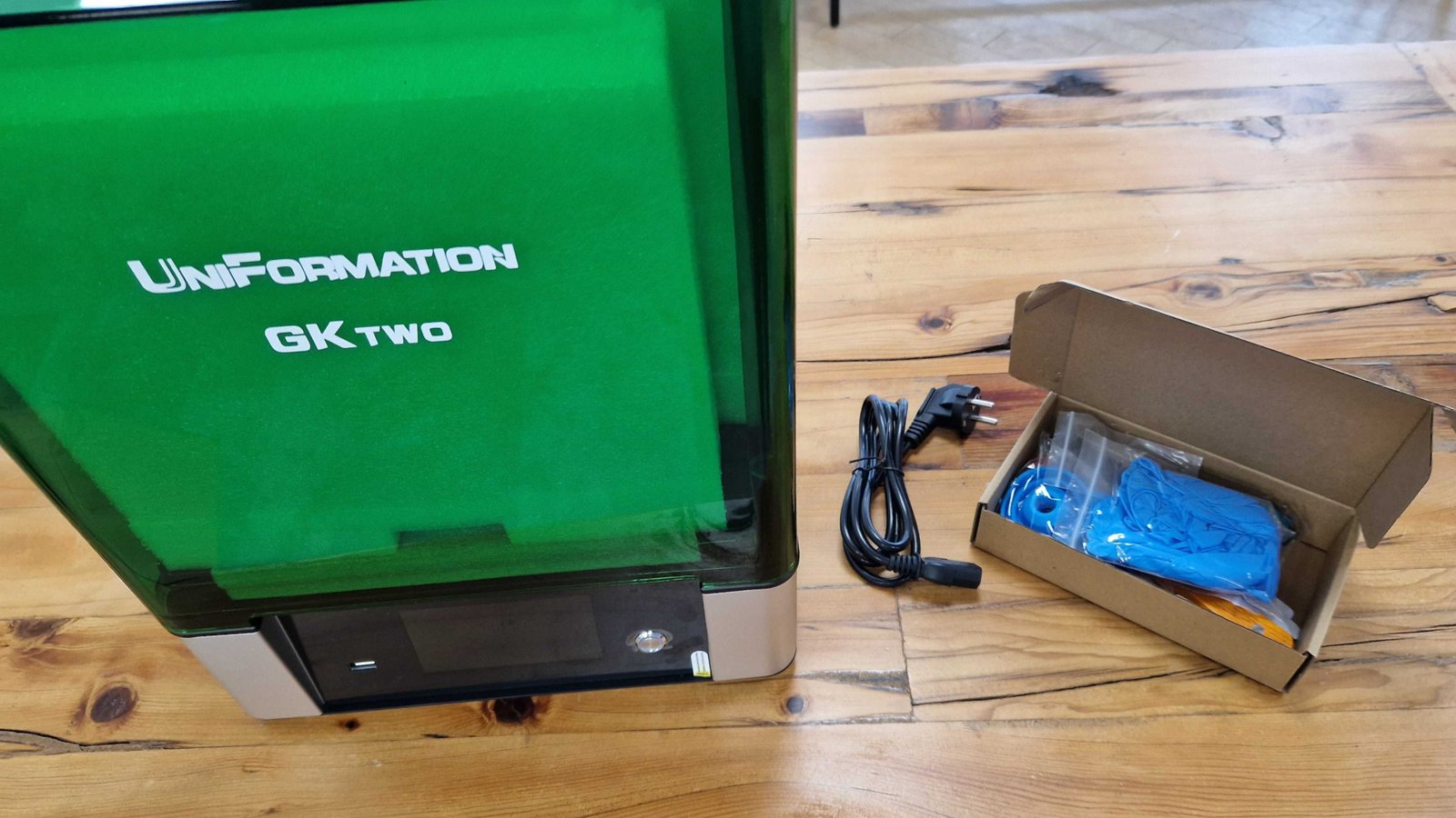 Uniformation GKtwo machine and power pack, along with a box of useful items