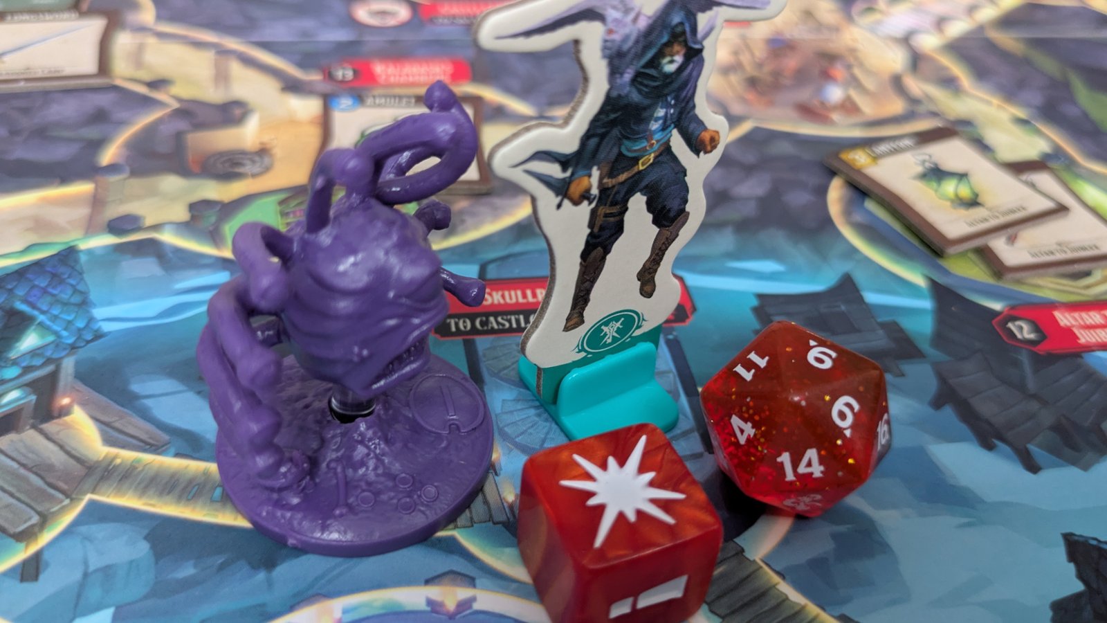 Horrified: Dungeons & Dragons Beholder and character token beside two dice, all on the board