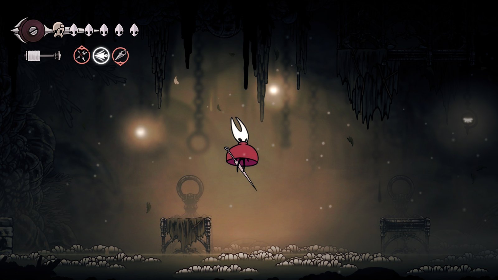Hornet uses her robe like a parachute to float above maggot-infested waters in Hollow Knight: Silksong