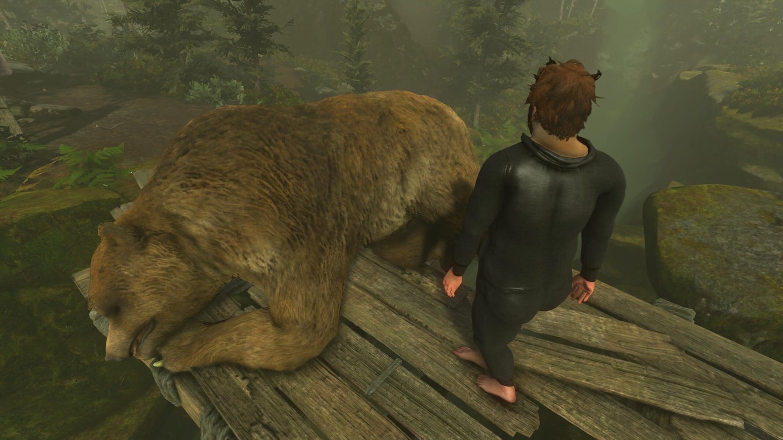 Nate stands next a sleeping bear in Baby Steps