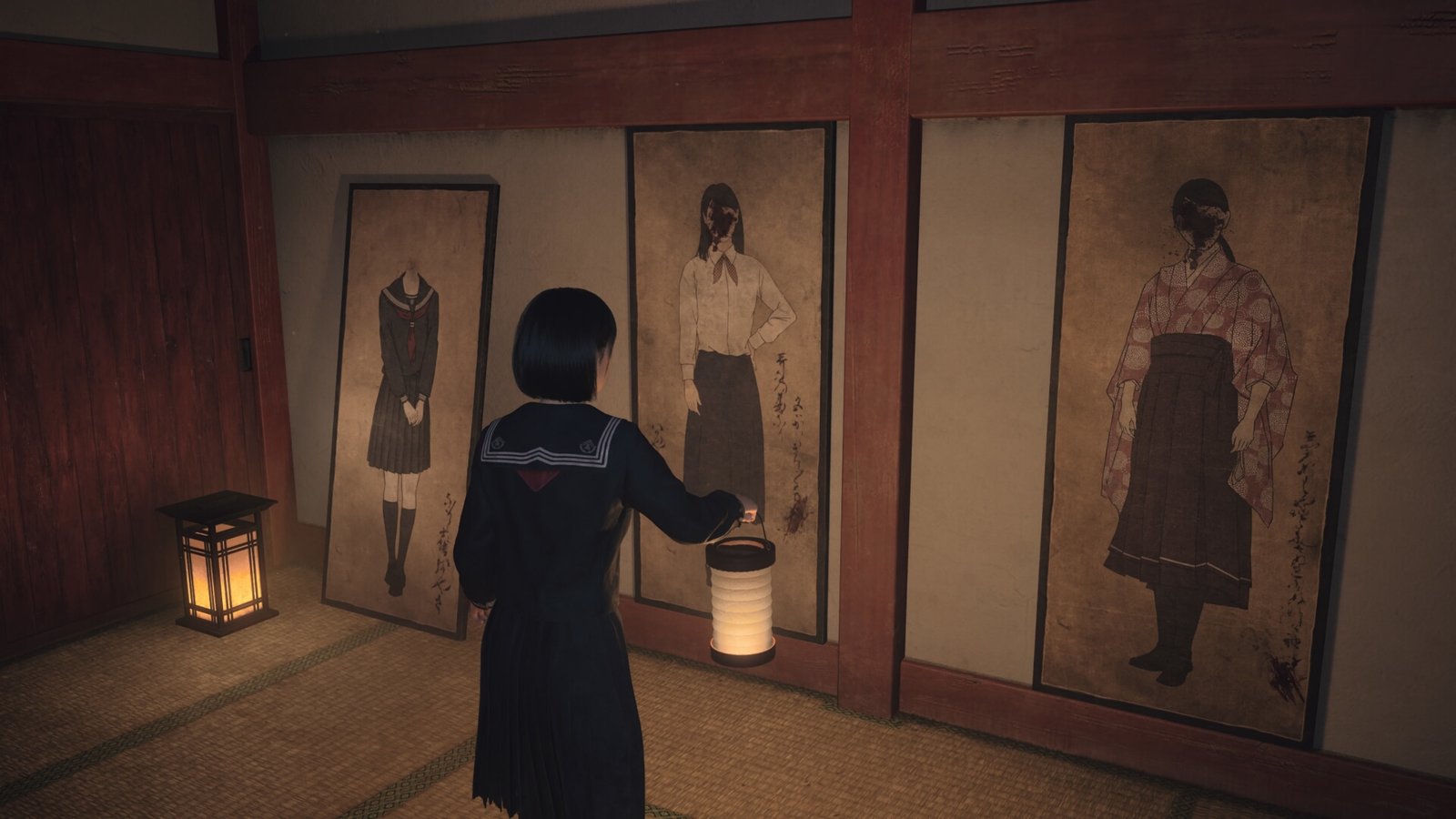 Lantern aloft, Hinako looks at portraits of women hung on a wall in a dark shrine room in Silent Hill f, with their faces obscured by ink splashes