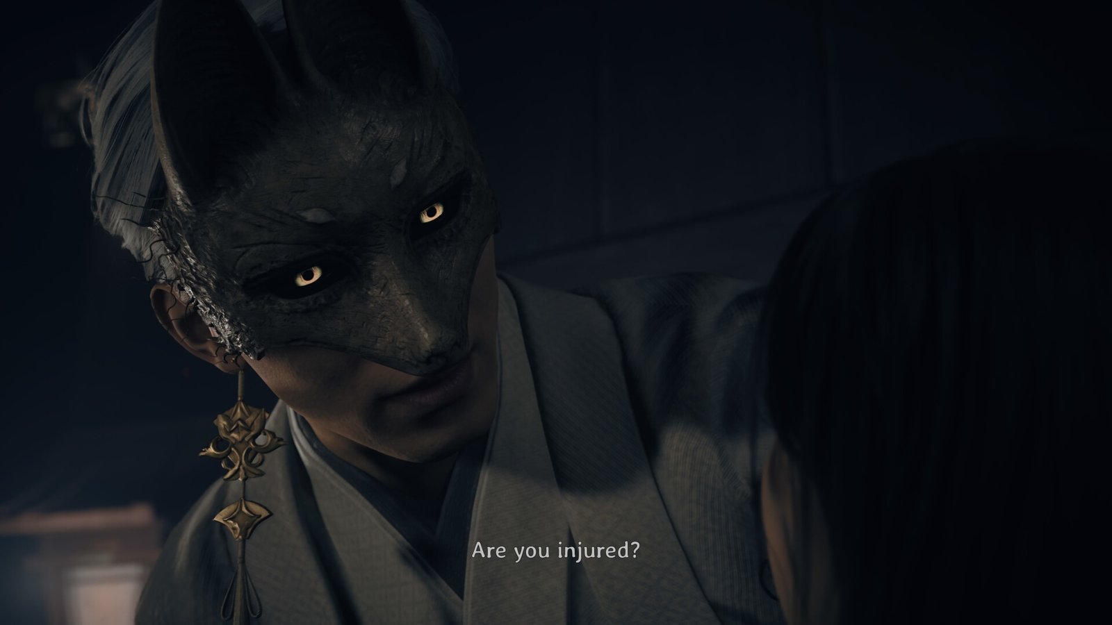 Fox Mask holds Hinako in his arms, his yellow eyes glowing, in Silent Hill f - he is asking "Are you injured?"
