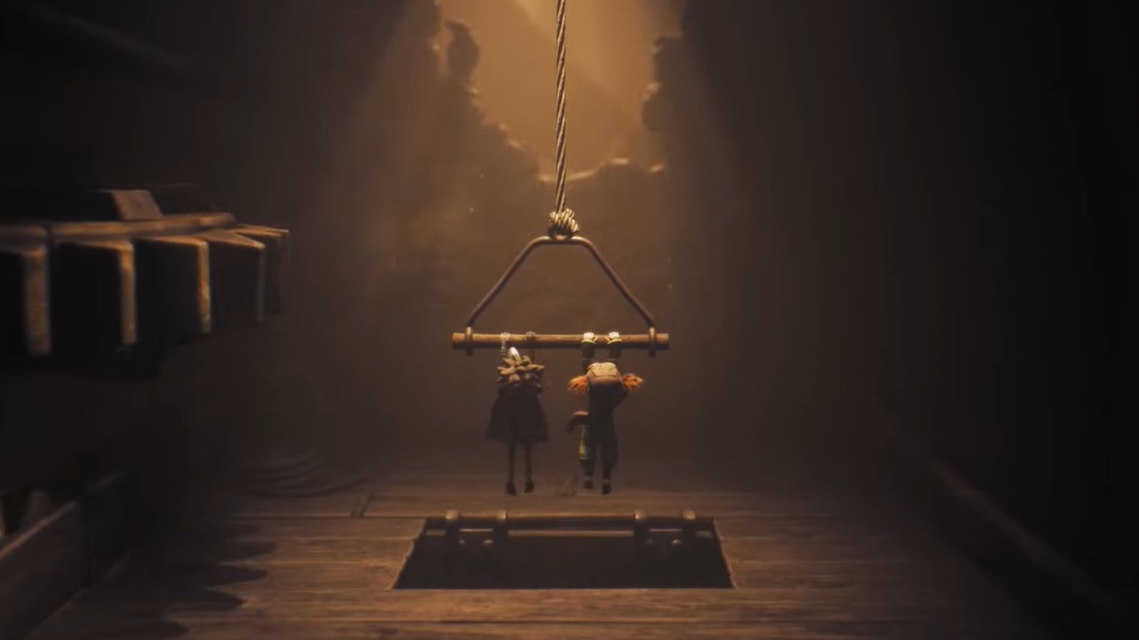 Little Nightmares 3 screenshot of Low and Alone pulling down a large lever together