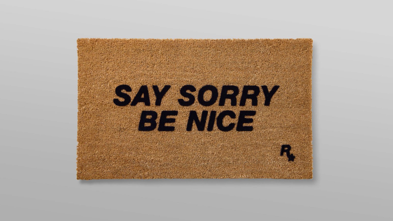 Rockstar welcome mat with 'Say Sorry, Be Nice' on it
