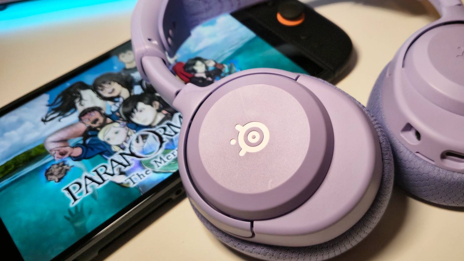 Photo of the Lavender Arctis Nova 3 Wireless sitting on a Switch 2.