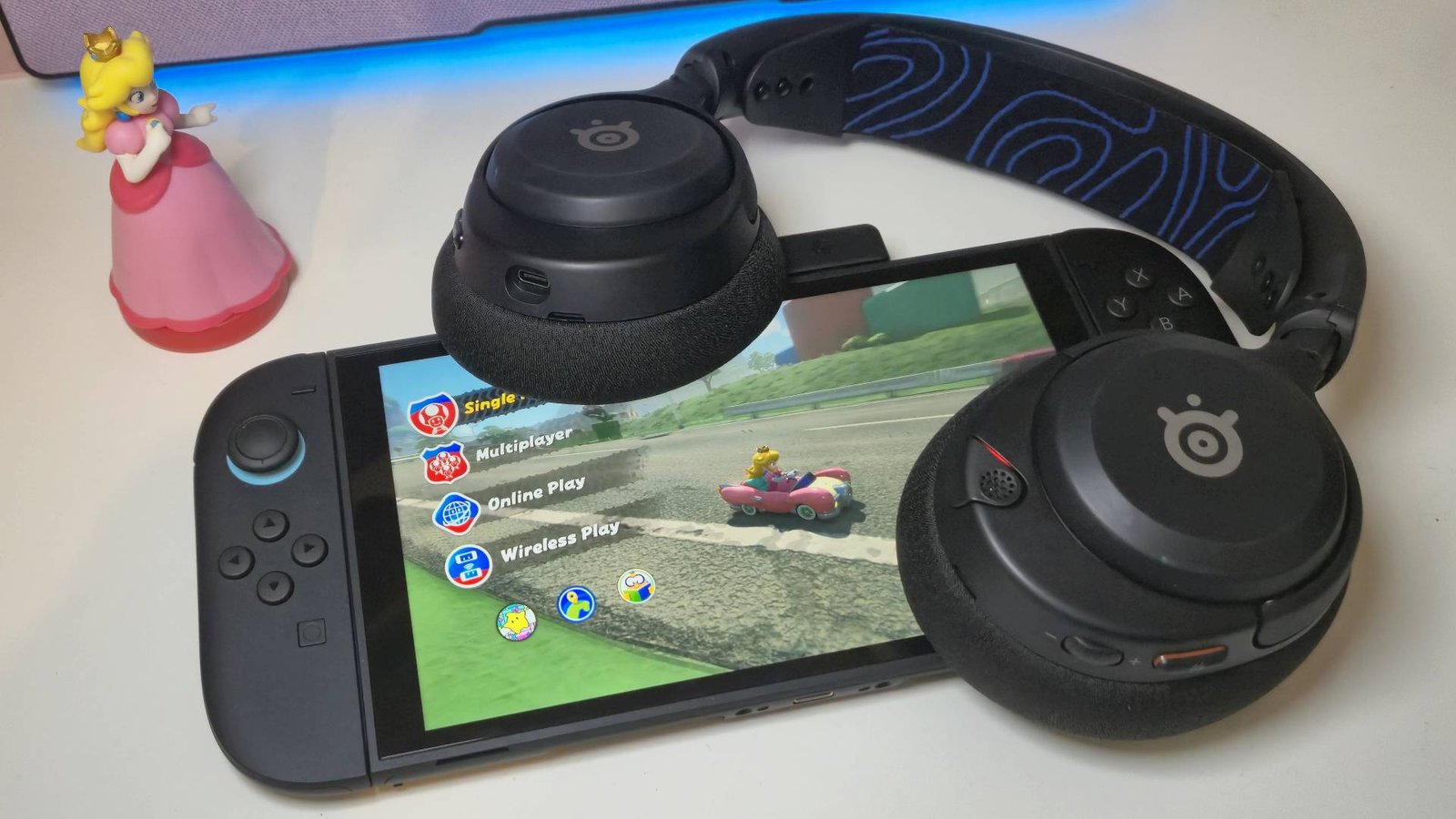 Photo of the SteelSeries Arctis Nova 5 Wireless headset sitting on top of the Nintendo Switch 2.