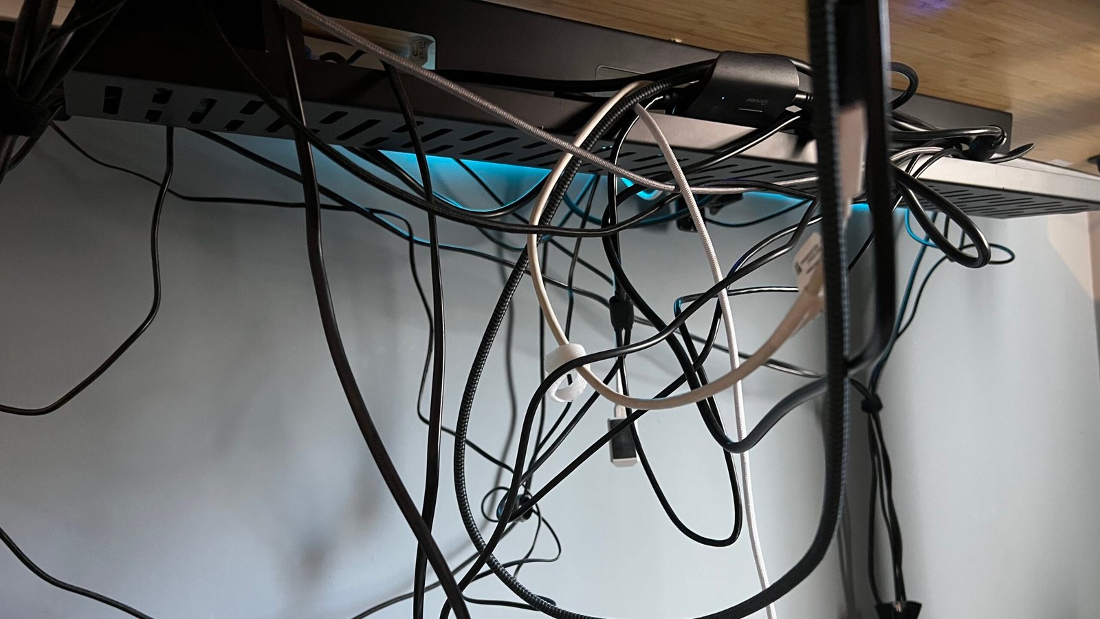 Cables hanging from the underside of a desk