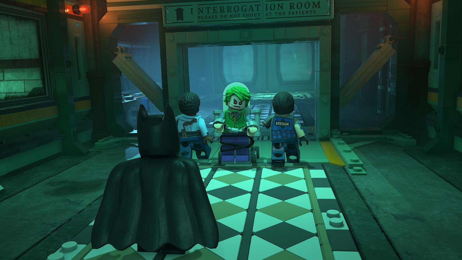 Batman walks behind a tied up Joker entering Arkham Asylum in Lego Batman: Legacy of the Dark Knight, a homage to the Batman: Arkham Asylum game