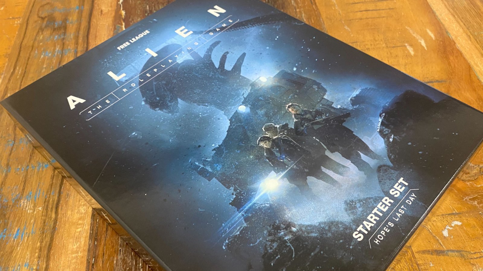Alien RPG Evolved Edition Starter Set box on a wooden surface