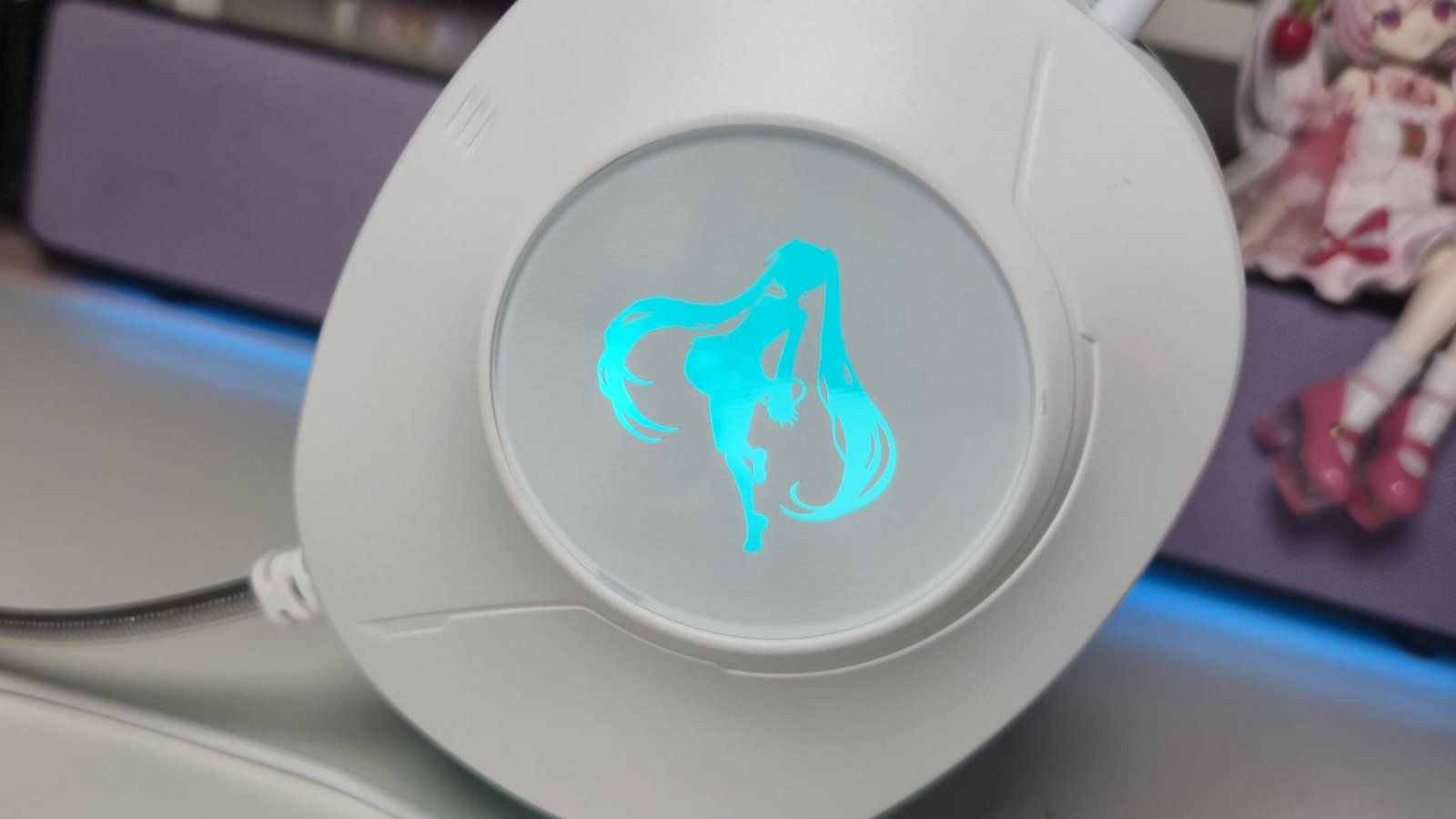 Photo of the side of the Asus TUF Gaming Hatsune Miku wired gaming headset.