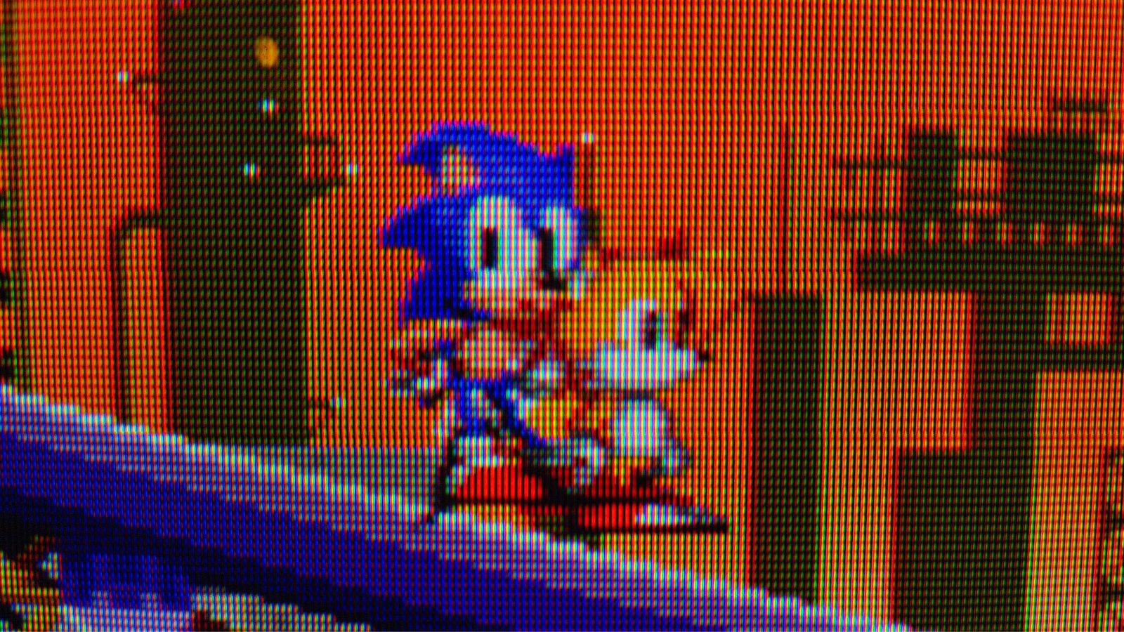 Close up of Sonic the Hedgehog 2 gameplay on Sony CRT TV with Sonic and Tails sprites standing on a slope.