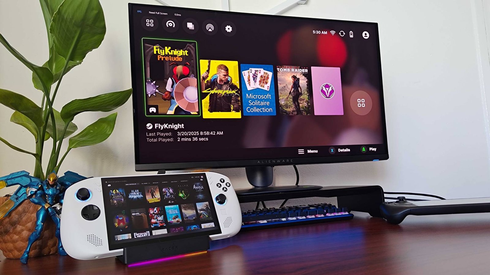 Razer Handheld Dock with Lenovo Legion Go connected and Razer Cortex software on Alienware monitor.