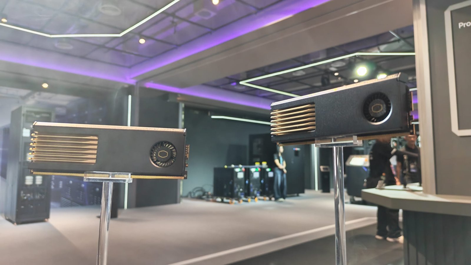 Two RAM modules hoisted on pedestals featuring Cooler Master's integrated cooling system for DDR5