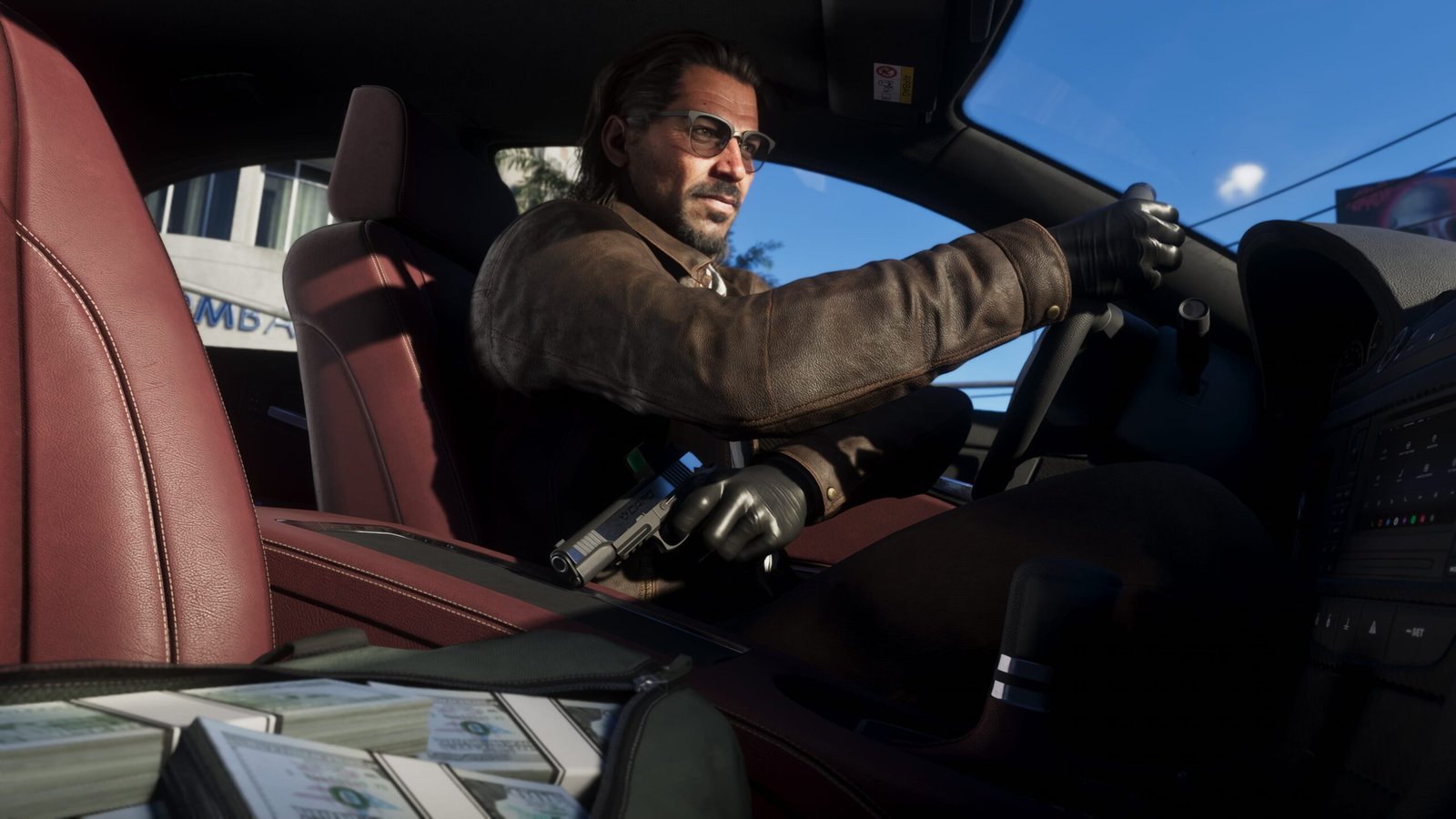 Raul Bautista sits in a vehicle holding a Capo pistol with a bag full of cash on the passenger seat
