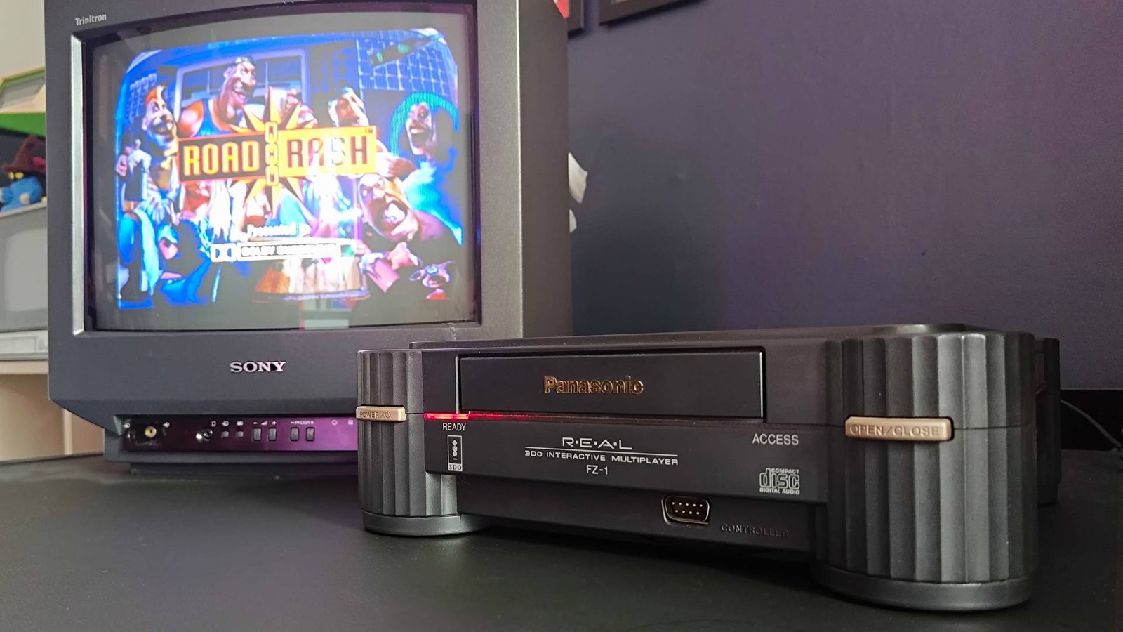 Panasonic 3DO plugged into Sony Trinitron CRT TV with Road Rash start screen on screen.
