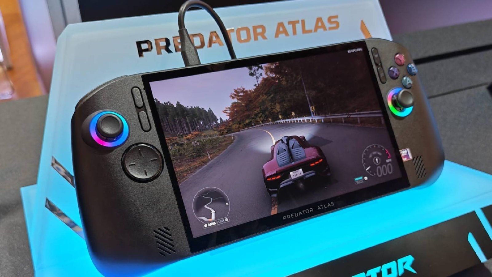 Photo of Acer Predator Atlas 8 handheld on acrylic stand.
